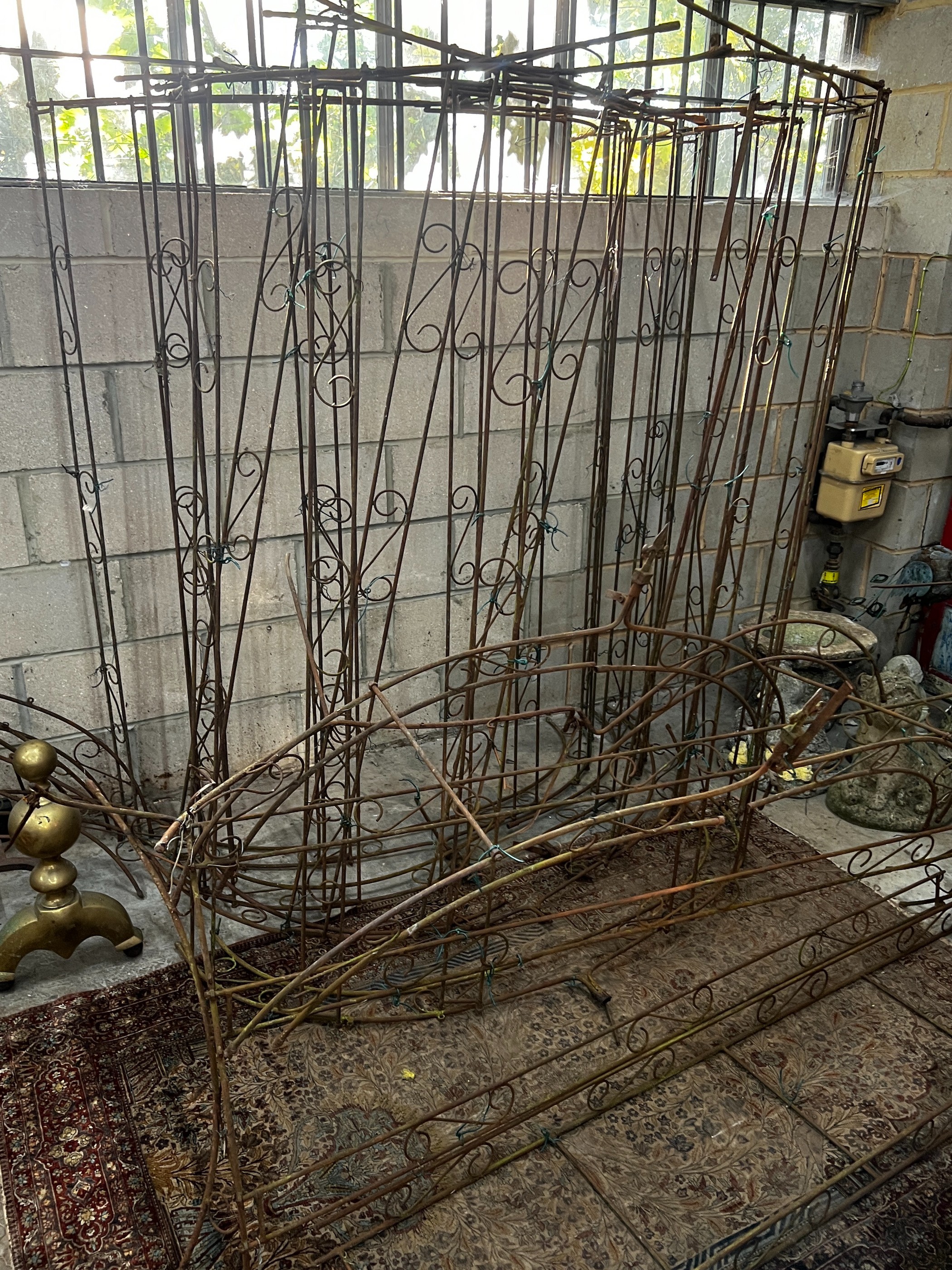 A wrought iron garden pergola (dis-assembled)